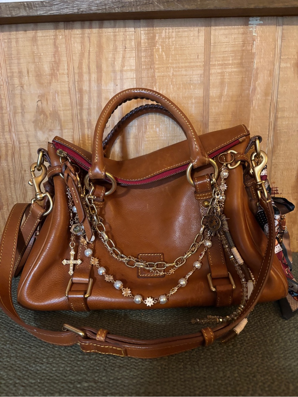 Dooney & Bourke leather tan handbag with Chain Accents & charms.